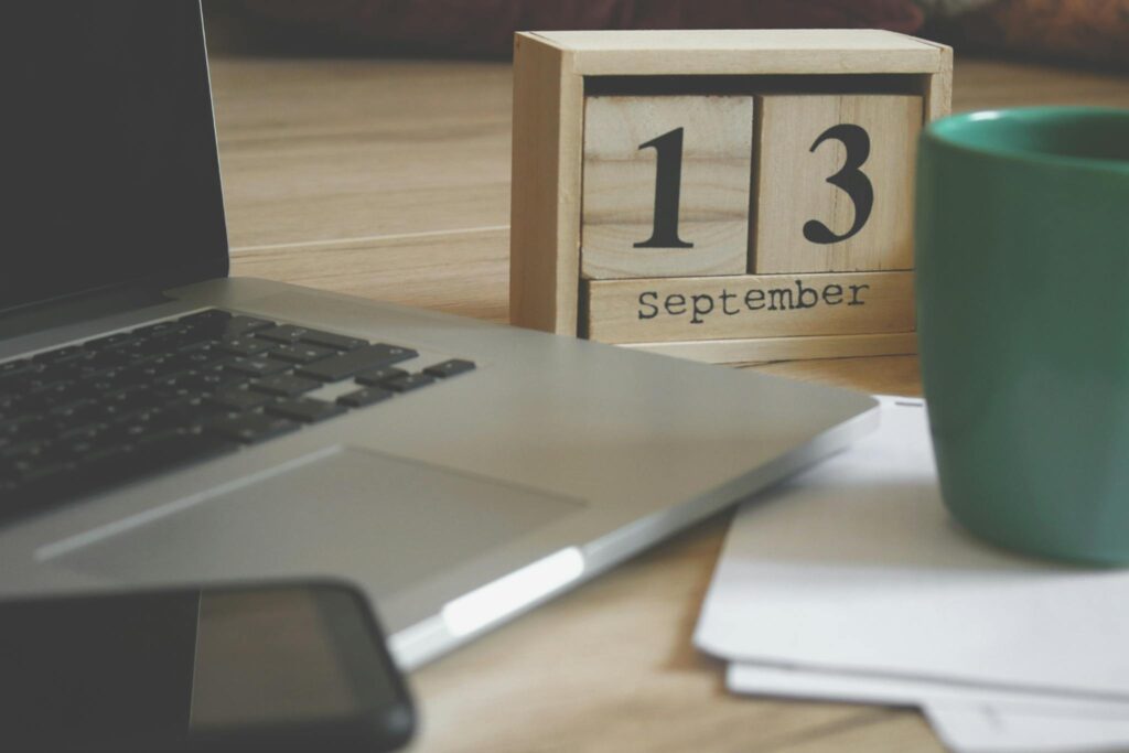 Brown Wooden Block Desk Calendar Displaying September 13